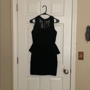 I’m selling a black dress with a lace back